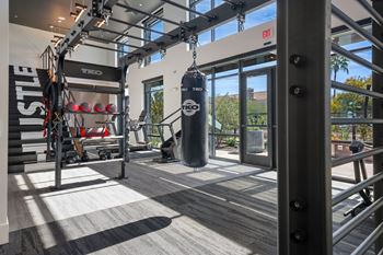 2 Story fitness center with free weights, strength machines, cardio theatre, and interactive bikes